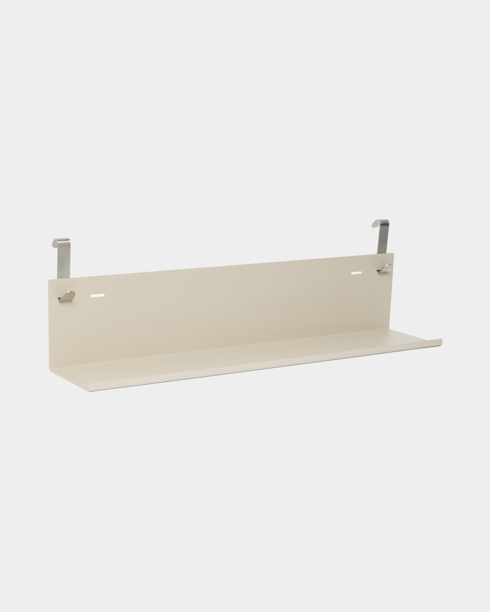 WoodUpp Nell Metal Shelf BM1 in beige, 63 x 13.4 cm, flat base with two metal brackets, powder-coated steel, displayed against a plain white background.